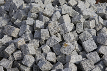 A pile of granite stones for construction.