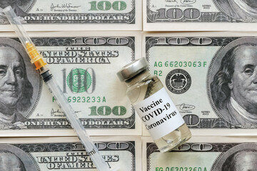 ampoule with vaccine and injectable insulin syringe on dollar bills, vaccination and treatment...