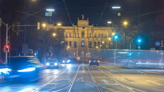 Munich traffic at night street Maximilianstrase in backround The Maximilianeum, a palatial building in Munich, was built as the home of a gifted students' foundation, Bavarian State Parliament.