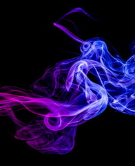 Colored smoke on black background
