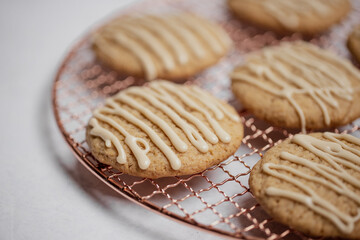Closeup of spiced cookies with beige maple icing