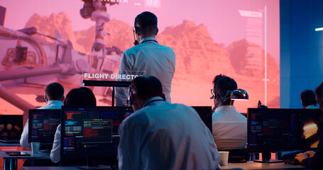 Team of operators controlling Mars rover remotely - obrazy, fototapety, plakaty