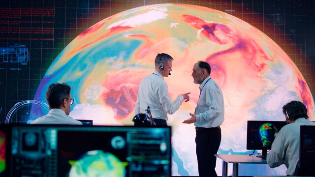 Senior ecologists discussing global warming with boss