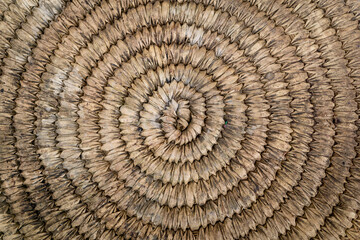 Background and texture of old natural round woven straw