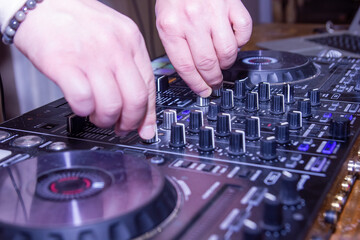 dj at work, dj mixing music, hands of a dj with dj panel