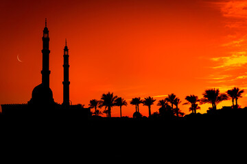 Beautiful large Islamic mosque at the sunset sky background