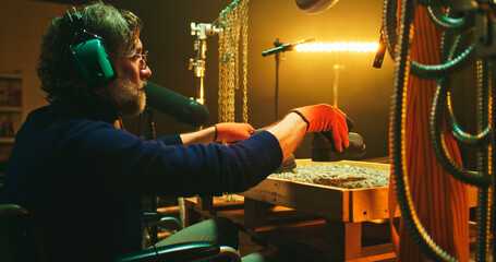 Middle aged sound designer with disability imitating robot steps