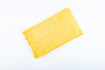 Golden dried tofu skin on white background