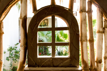 Old wooden doors at the beautiful tropical garden