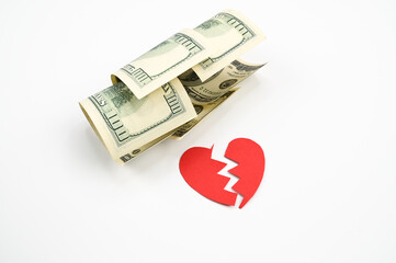 Dollars and broken heart, on an isolated white background