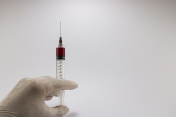 Syringe filled with medicine on isolated white background