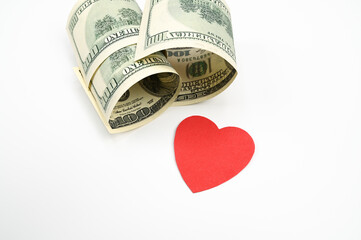 Dollars and heart, on an isolated white background