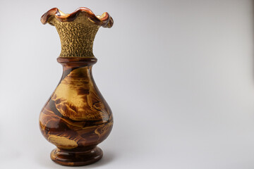 Golden brown vase on white background