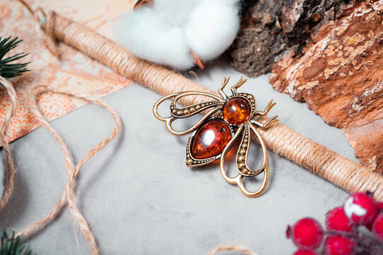Bronze and amber brooch in the form of fly