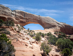 Astounding Wilson Arch Trail in a semi desert landscape in Moab Utah during summer
