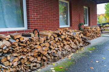 wooden logs are dried under the roof