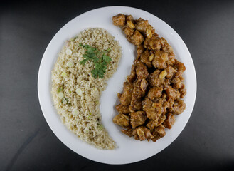 Honey butter chicken with rice on isolated white background