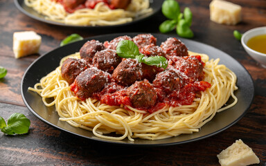 Vegetarian spaghetti with meat free, vegan meatballs in rich tomato sauce, grated cheese and basil...