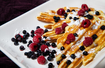 Viennese homemade waffles in electrical grill without special form for waffle