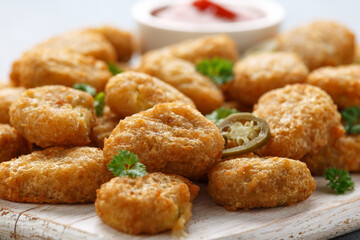 Crispy Jalapeno Popper with creamy cheese battered on white wooden board
