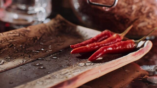 Fresh red peppers prepared for serving, apetizer in an american restaurant. Spicy BBQ, red peppers served with whisky, stylish dinner for a man.
