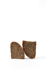 Two pieces of rye bread on a white background, triangular shape. Useful product.