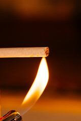 The flame ignites the cigarette. The concept of addiction to smoking tobacco, cigarettes