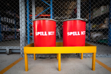 Spill kit containment boxes are prepared and placed in front of the chemical storage room. Using in...