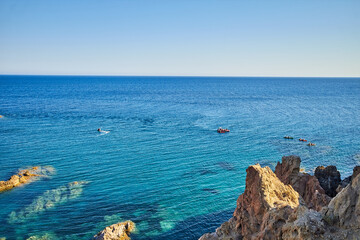 View of natural rock formations in the rugged coastline of Cabo de Gata Natural park on the Mediterranean sea in Almeria, Spain.