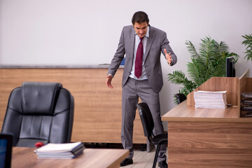 Fototapeta premium Young businessman employee in bullying concept in the office
