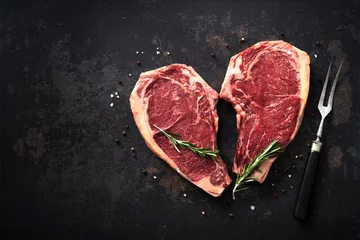 Poster Hartvormige raw dry aged beef rib steaks (cote de boeuf) © Alexander Raths