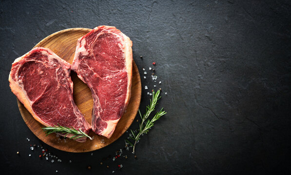 Heart shape raw dry aged beef rib steaks (cote de boeuf)