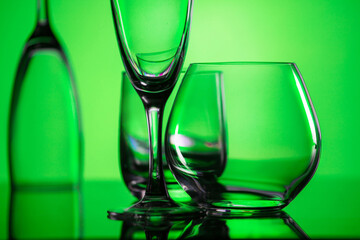 glasses of whiskey and champagne on a bright multicolored background.