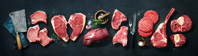 Fotobehang Variety of raw cuts of meat, dry aged beef steaks and hamburger patties © Alexander Raths