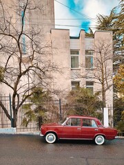 A car parked in front of a building, retro soviet style ussr