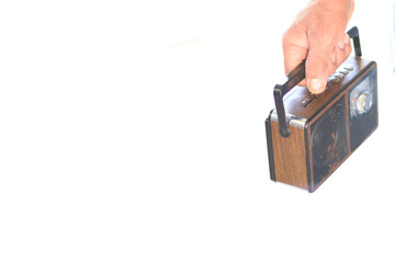 hand holding old radio