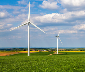 Wind turbines on green field