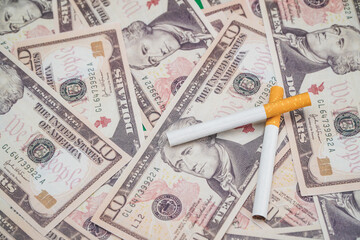 cigarettes with a dollar background