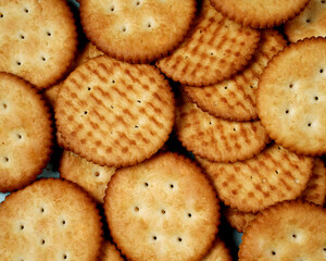 Biscuits are a crunchy snack product made by baking them. Several types of biscuits are arranged in unique formations to create a beautiful image that is suitable as a background. Wallpaper biscuits.