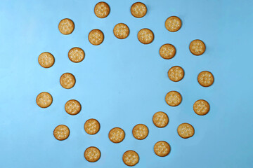 Biscuits are a crunchy snack product made by baking them. Several types of biscuits are arranged in unique formations to create a beautiful image that is suitable as a background. Wallpaper biscuits.