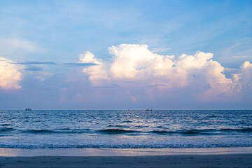 Obraz premium Huahin sea and sky line at the evening with fisherman boat nearby Khao Takiab beach mountain