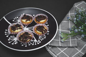 selective focus of cheese tart on the table with a cinematic light.