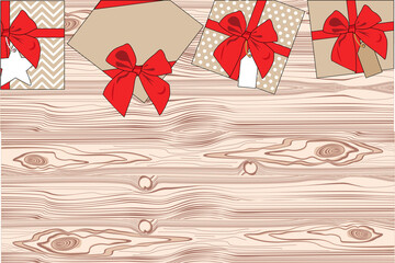 gifts on a wooden background with a red ribbon. view from above