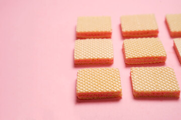 Stack of random wafers isolated on yellow background. Delicious biscuit wafers are loved by all ages. Dry and crispy wafers ready to eat. Ready to start the day with wafers. Wafer wallpapers.