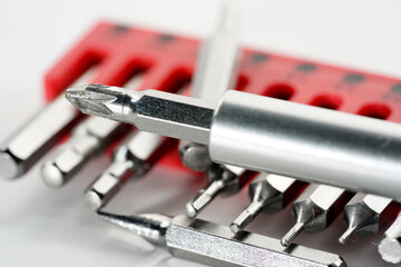 Fototapeta premium Screwdriver bits made from tool steel in the red box photographed against a white background in the studio