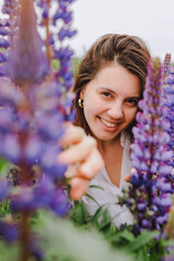 woman at blooming lupines field