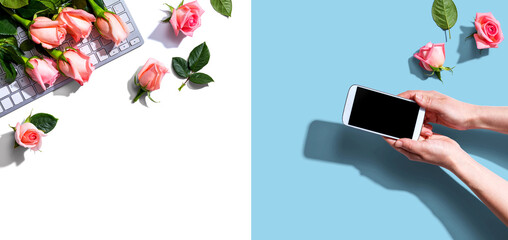 Woman holding her smartphone with pink roses overhead view - flat lay