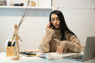 Cropped shot of two UI developers meeting on their project with paperwork and tablet on meeting...