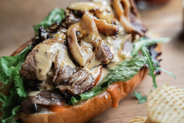 Close up of delicious meat hot dogs with mustard and onion sauce