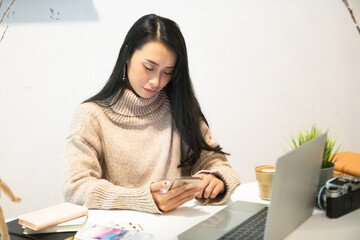 Cropped shot of two UI developers meeting on their project with paperwork and tablet on meeting...